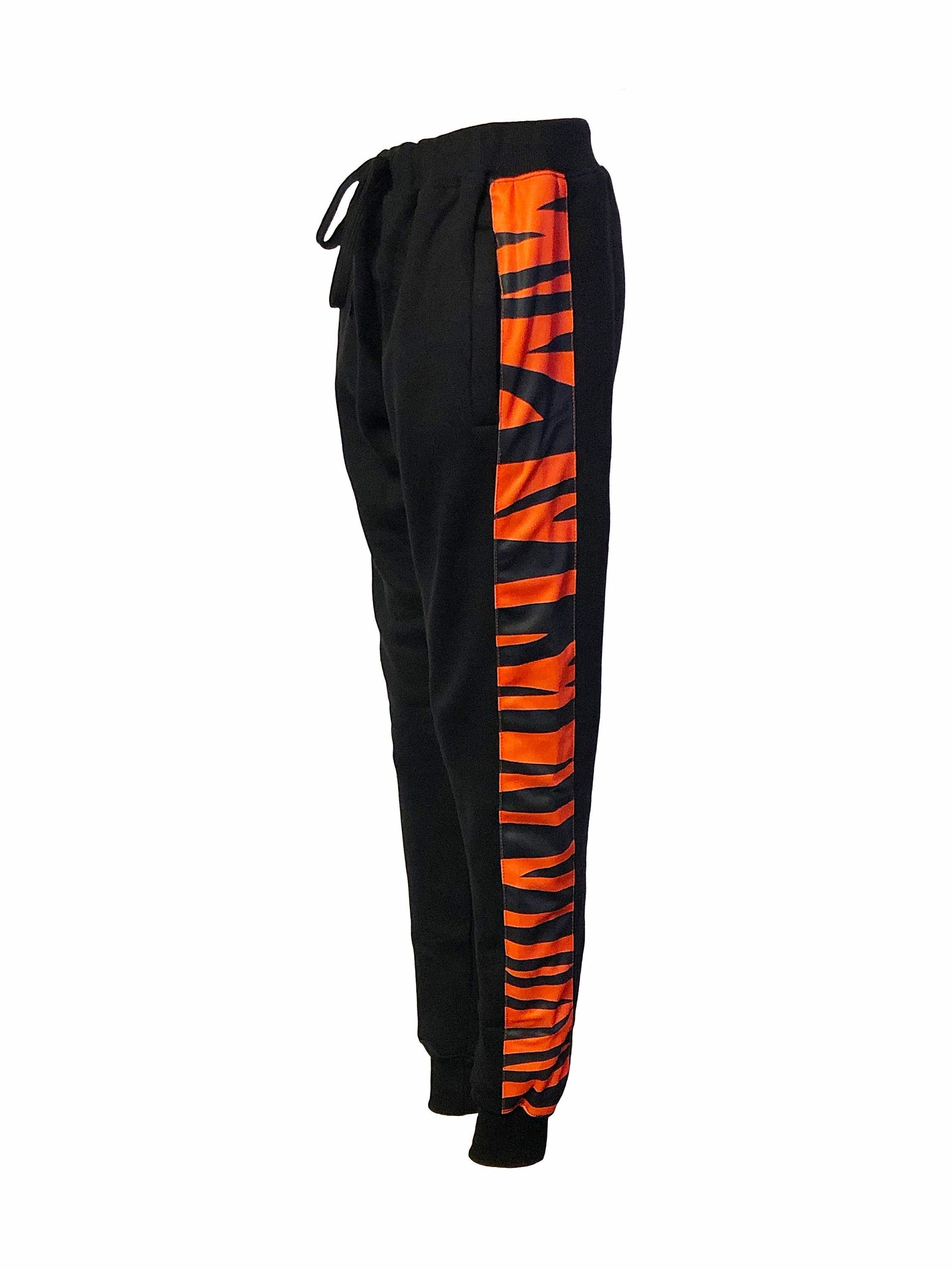 Black pants with orange 2025 stripe